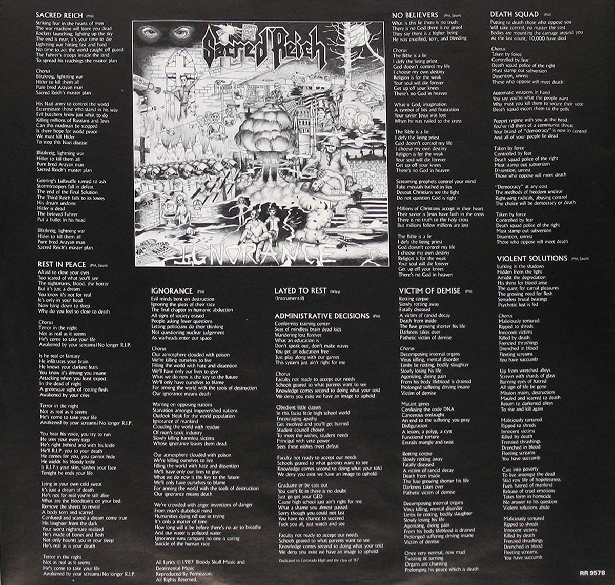 Sacred Reich Ignorance 1987 inner sleeve. A black background with white text featuring all song lyrics, including 'Sacred Reich,' 'Ignorance,' and 'Death Squad.' At the center is a detailed black-and-white illustration depicting war, destruction, and political imagery. The design complements the album's aggressive thrash metal themes and socially conscious lyrics.